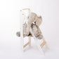 white montessori learning tower foldable with toy elephant on it